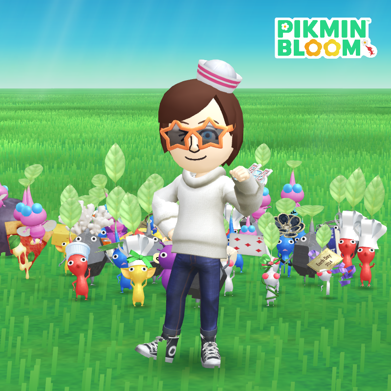 A mii poses with a thumbs up and a multi colored squad of Pikmin behind them. 